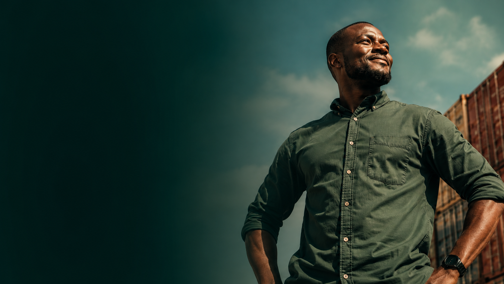 A confident African business owner standing among shipping containers, representing the buyers Sódu serves across Africa.
